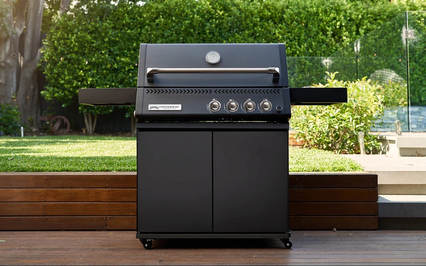 Black Crossray gas barbecue on a garden terrace